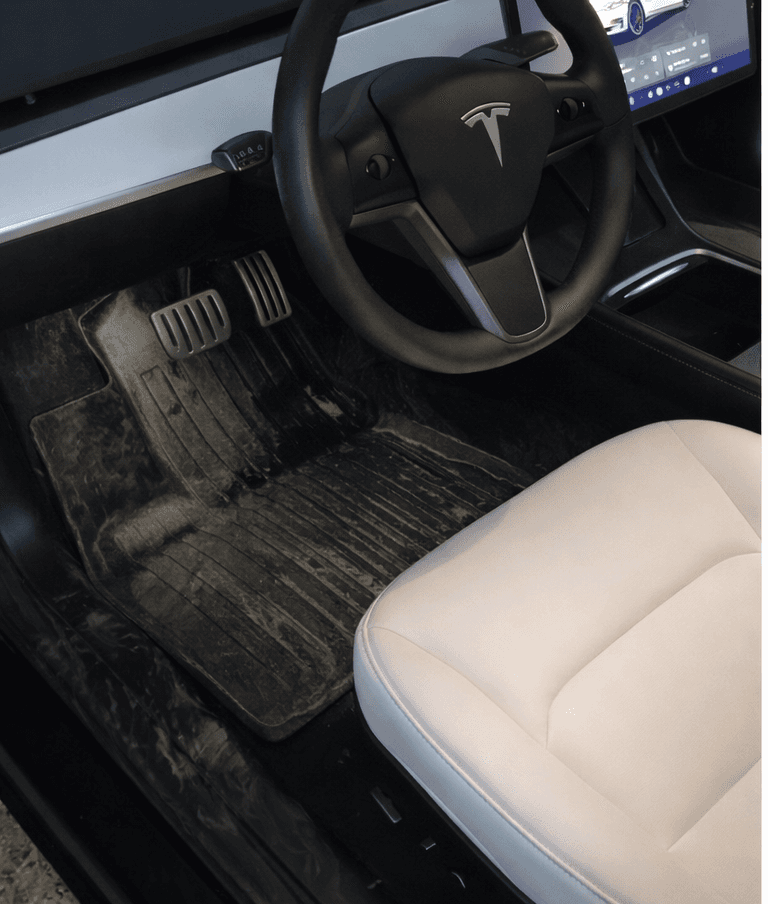 Tesla Model 3 floor — Polish Pistons interior deep clean — before